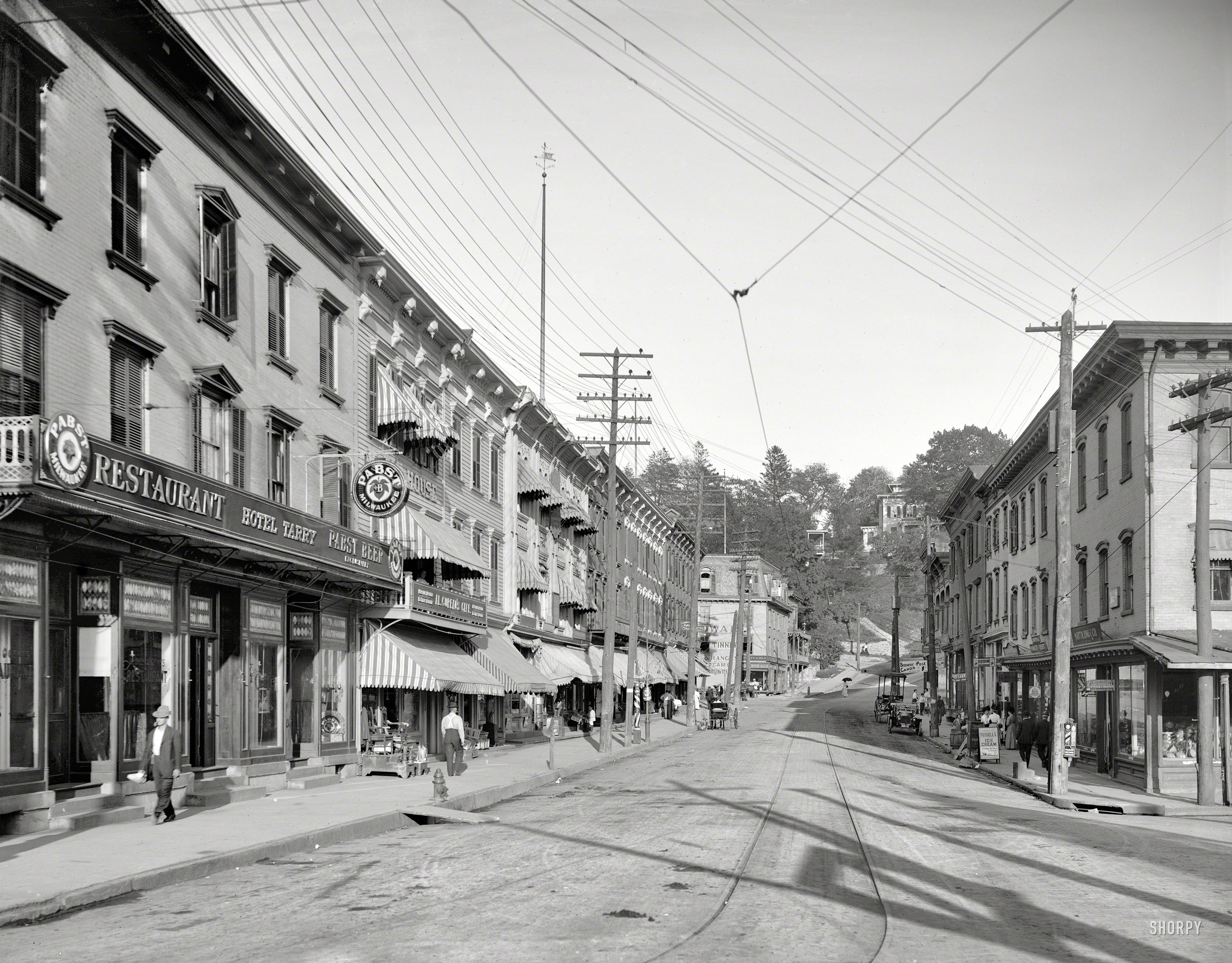 Circa 1913. "Main Street -- Tarrytown, New York." Let's meet on the wicked side of the street. 8x10 inch glass negative, Detroit Publishing Co. View full size.