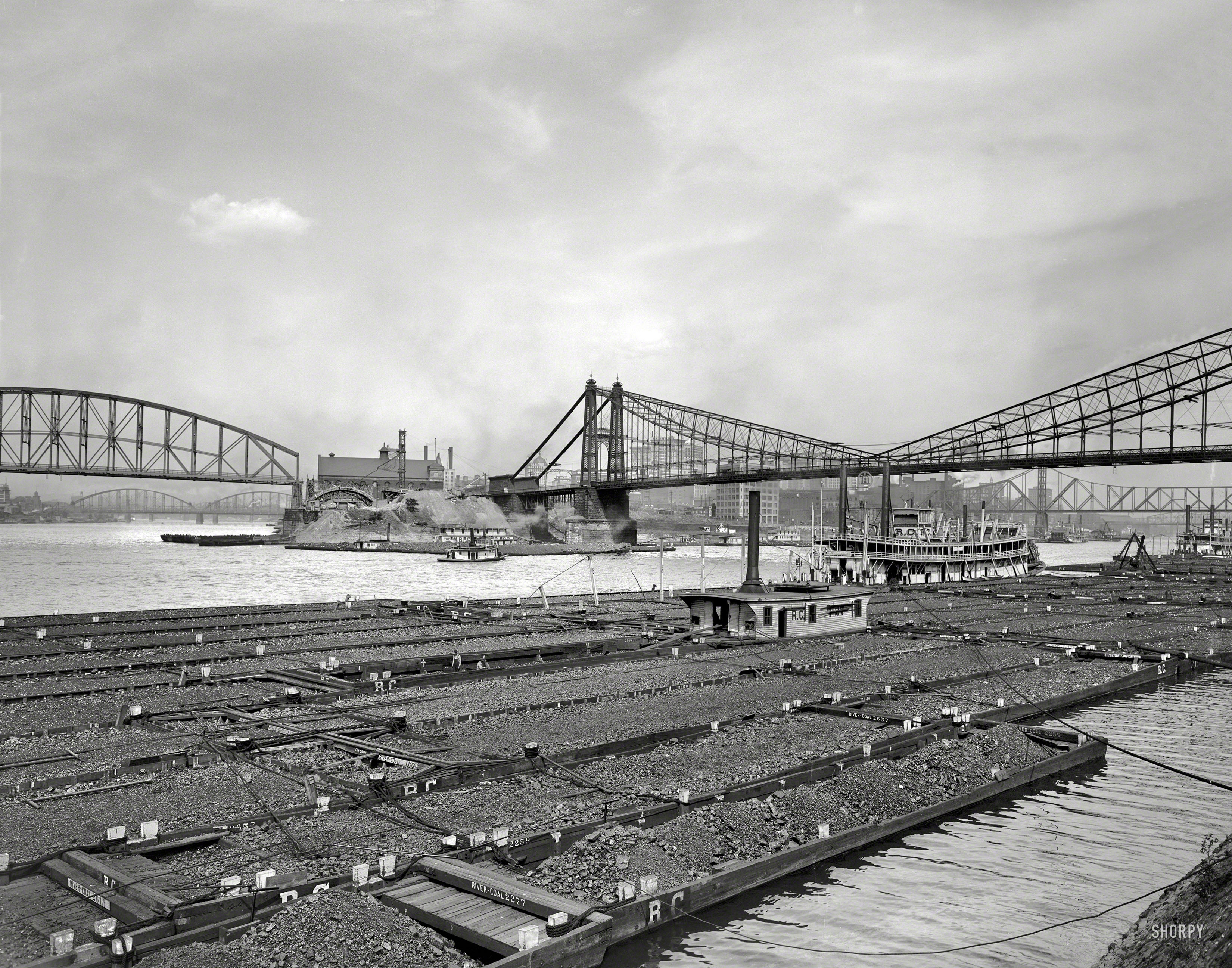 Circa 1910. "Coal barges at confluence of Allegheny and Monongahela rivers at Pittsburgh, Pennsylvania." 8x10 inch  glass negative. View full size.