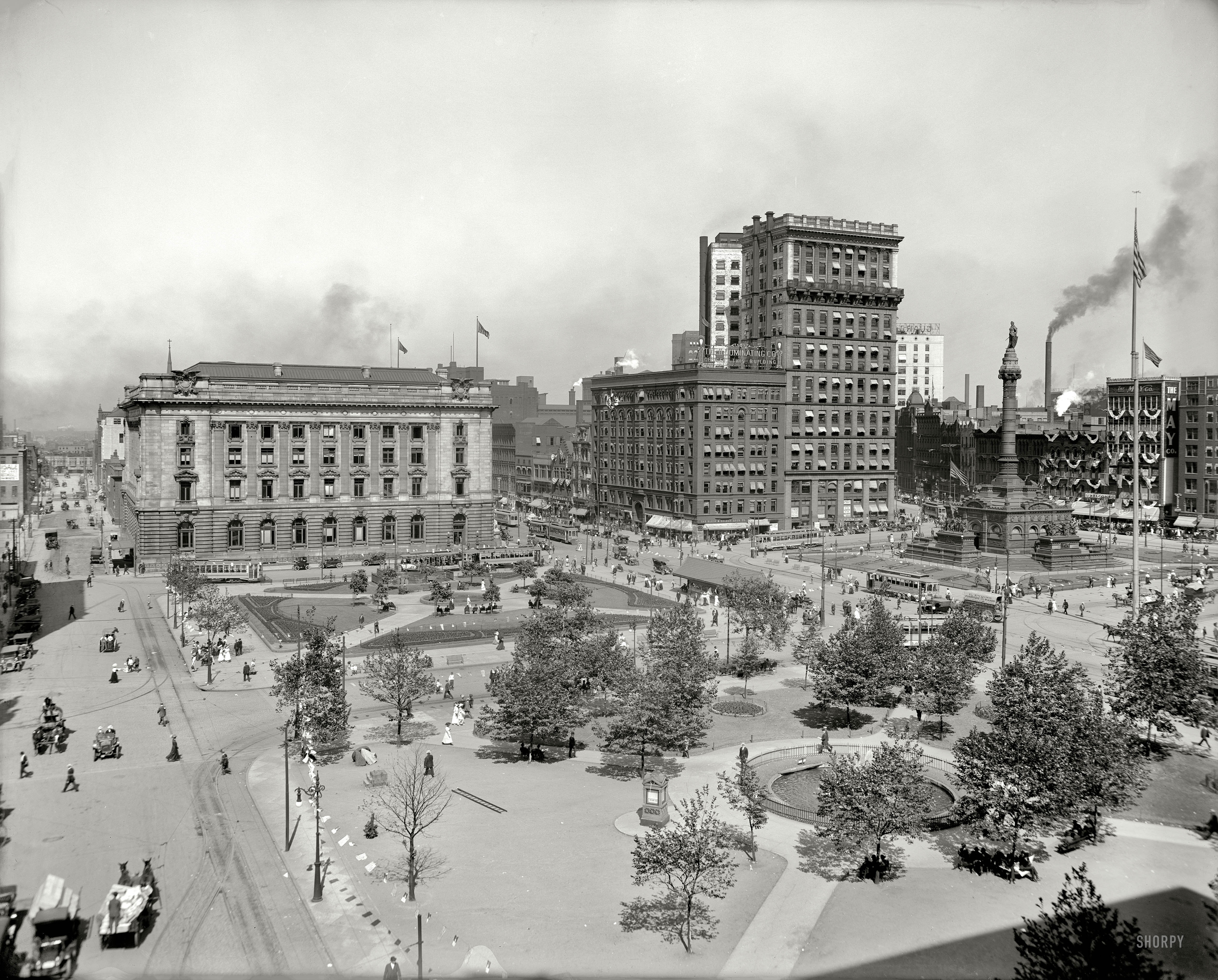 Cleveland, Ohio, circa 1911. "The Public Square -- Soldiers' and Sailors' Monument." A bustling scene, patriotically decorated. View full size.