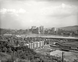 Circa 1910. "Pittsburgh waterfront, Allegheny River." Something for everyone here: Bridges, riverboats, a rail yard and two baseball games. And a high-rise natatorium. 8x10 glass negative, Detroit Publishing Co. View full size.