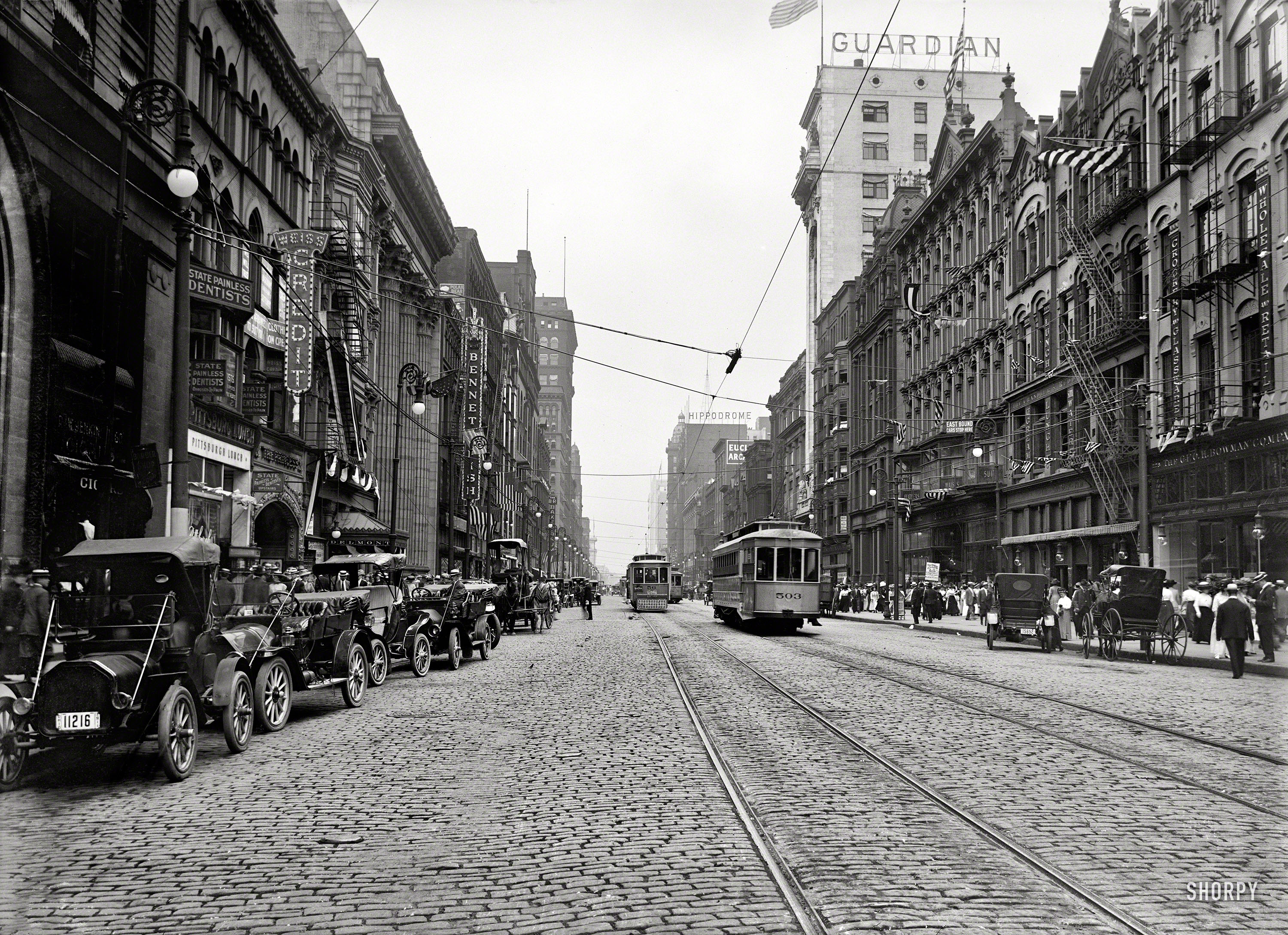 Cleveland, Ohio, in 1911. "Euclid Avenue." Painless dentists and quick-service lunchrooms in easy walking distance. 5x7 glass negative. View full size.