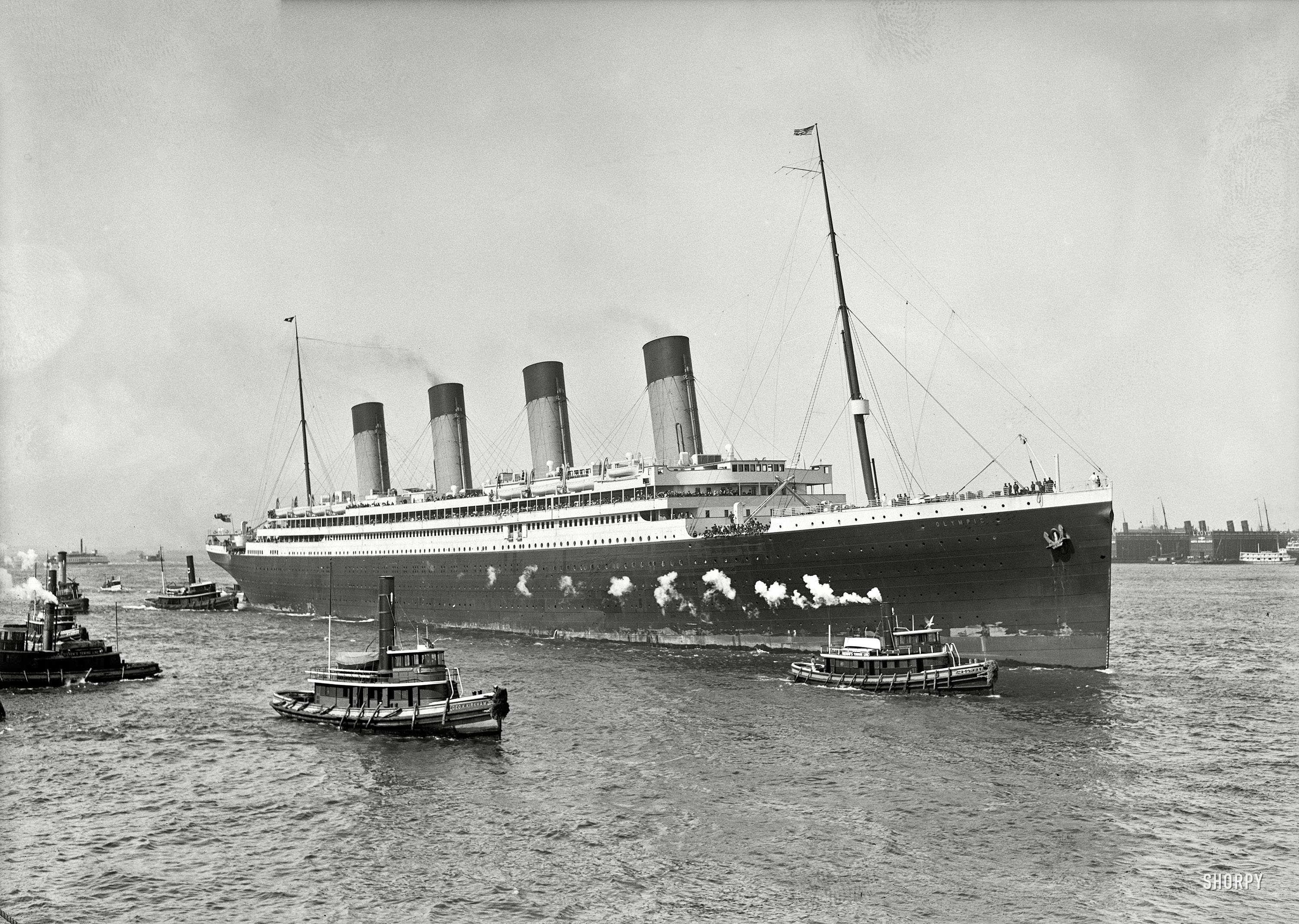 New York. June 21, 1911. "White Star liner S.S. Olympic guided in by tugboats Geo. K. Kirkham and Downer." Detroit Publishing glass negative. View full size.