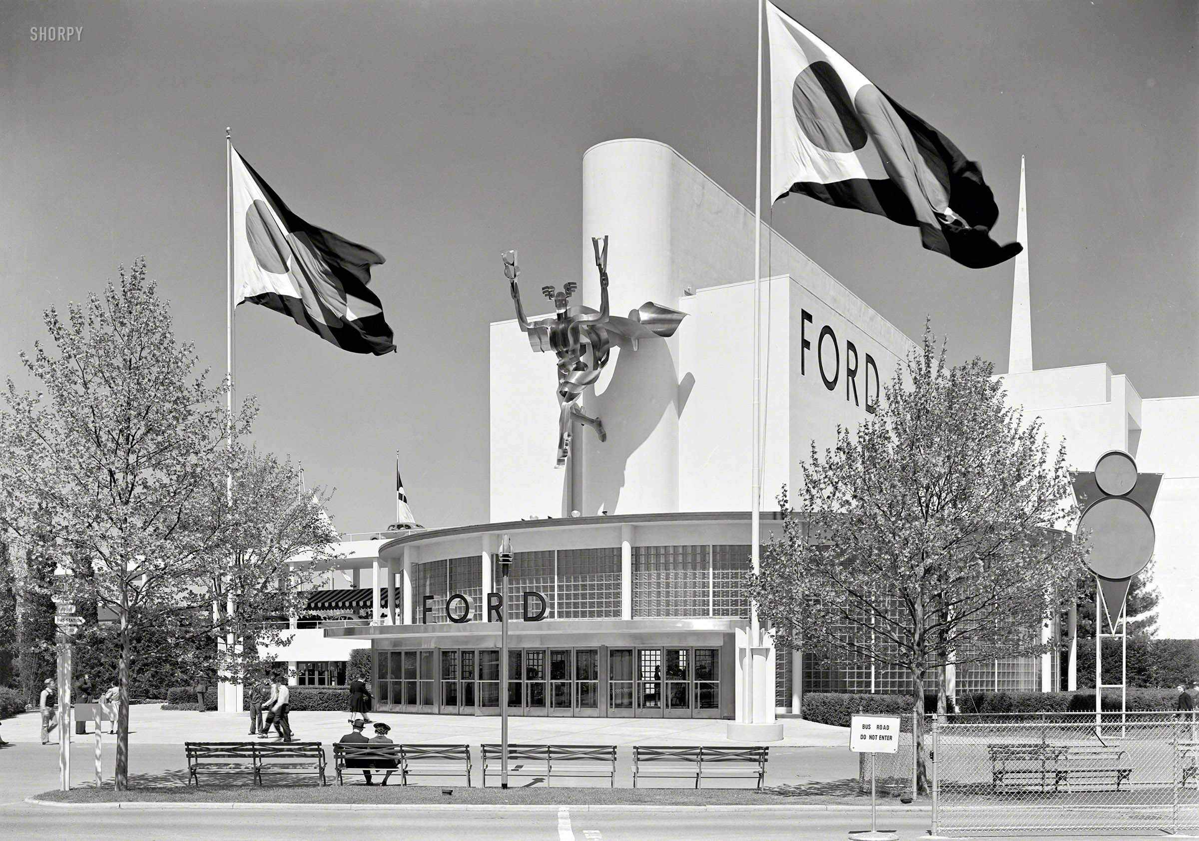 May 12, 1939. "New York World's Fair, Ford Motor Building. Entrance." The stainless steel sculpture of a V8-brandishing Mercury was by Robert Foster. Large-format acetate negative by Gottscho-Schleisner. View full size.