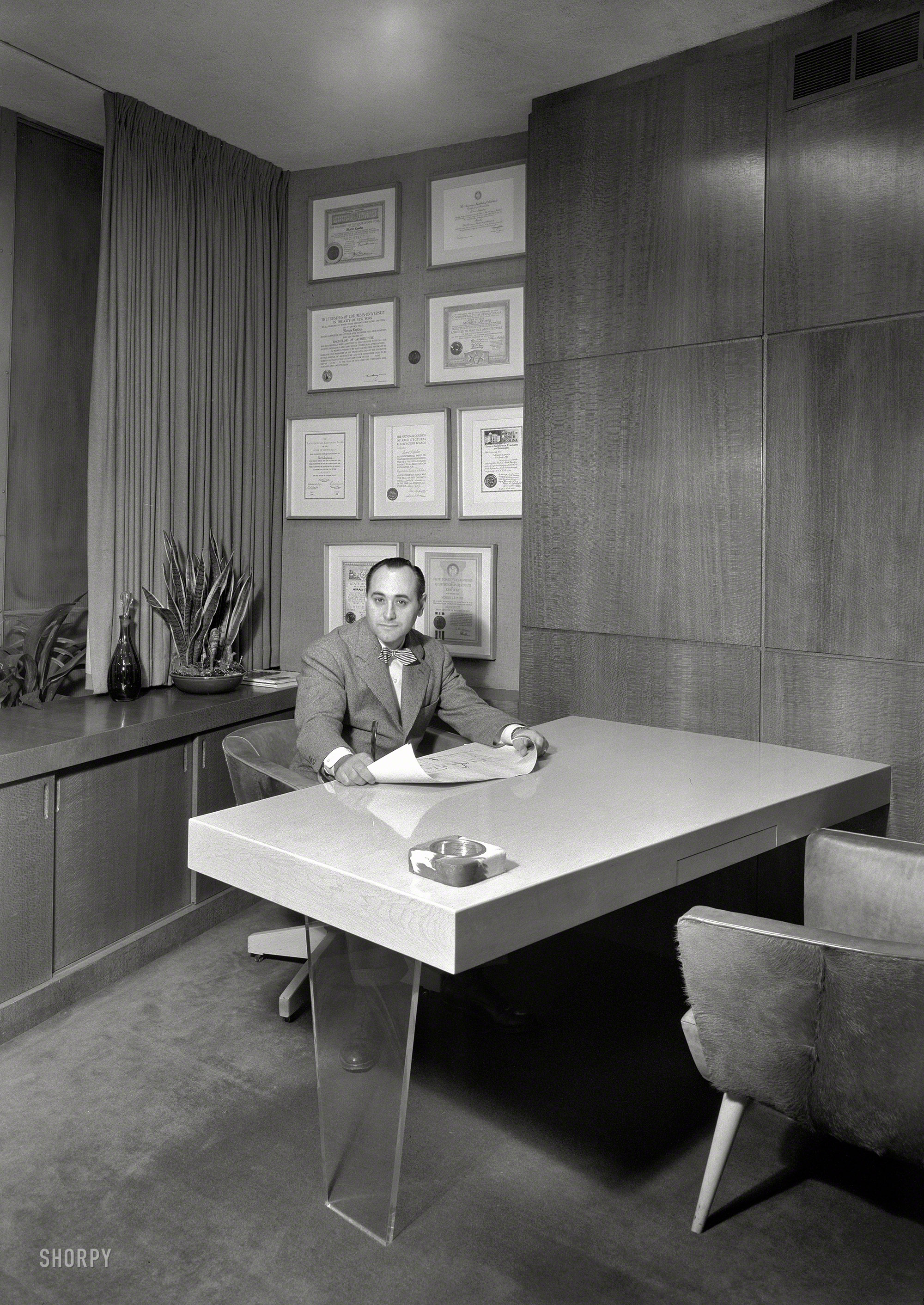 &nbsp; &nbsp; &nbsp; &nbsp; The architectural ubermensch of Miami Beach, best remembered for the Fontainebleau Hotel.
Dec. 13, 1946. "Morris Lapidus, 256 E. 49th Street, New York. Lapidus in his office." Large-format acetate negative by Gottscho-Schleisner. View full size.