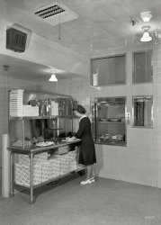 July 2, 1948. "Schrafft's, Esso Building, Rockefeller Center. Dumbwaiter." How lunch gets launched. Gottscho-Schleisner photo. View full size.