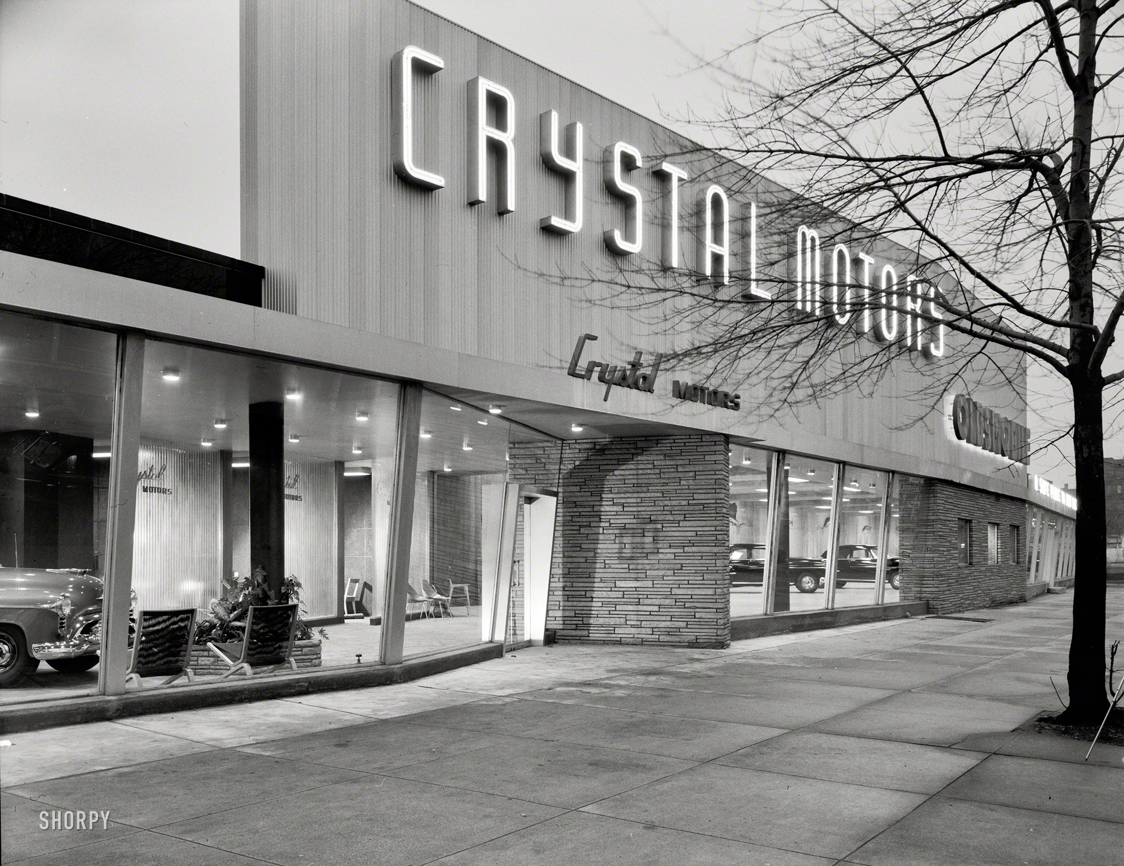 Feb. 15, 1950. "Crystal Motors, business at 5901 Bay Parkway, Brooklyn, New York. Exterior I." The Oldsmobile emporium last glimpsed here. Large-format acetate negative by Gottscho-Schleisner. View full size.