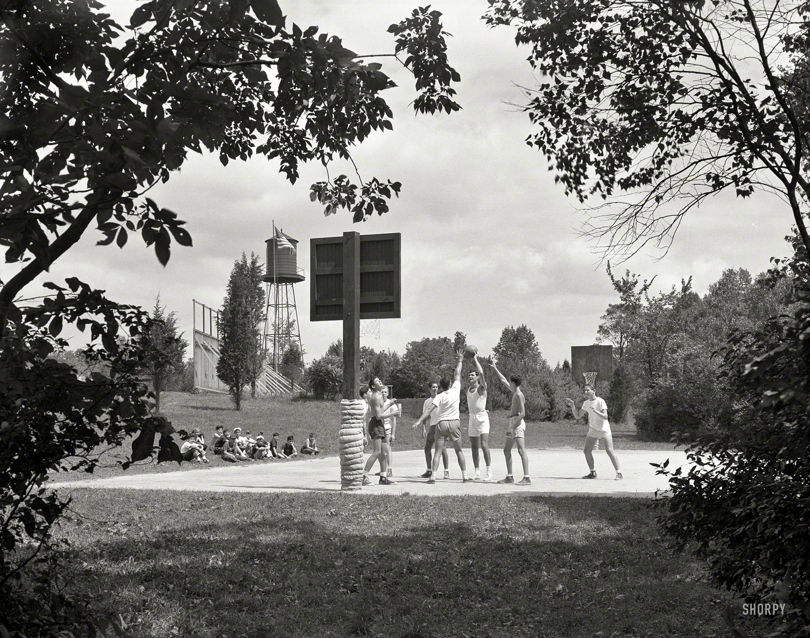 August 23, 1951. "Indian Head Camp, Bushkill, Pennsylvania. Boys on basketball court." Large-format acetate negative by Gottscho-Schleisner. View full size.