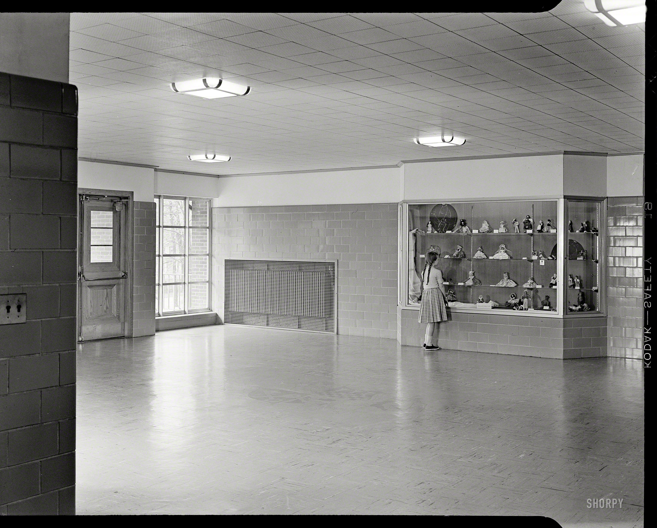 April 28, 1952. "Walter R. Dolan Junior High School, Toms Road, Stamford, Connecticut. Entrance foyer." Continuing today's girls-and-dolls theme. Large-format acetate negative by Gottscho-Schleisner. View full size.