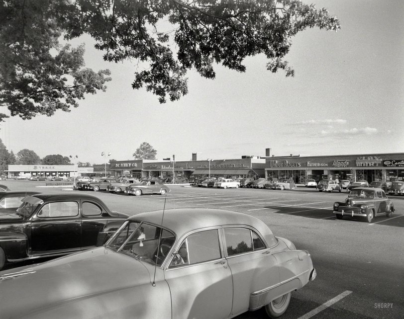 Sept. 27, 1954. Smithtown, New York. "Smithtown Shopping Center. General view." Meet you at Play Mart in an hour. Gottscho-Schleisner photo. View full size.
