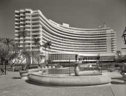 March 30, 1955. "Fontainebleau Hotel, Miami Beach. Over pool to hotel. Morris Lapidus, client." The luxe hostelry's first "season" after its opening. Large-format acetate negative by Gottscho-Schleisner. View full size.
In My DreamsOh, to make a reservation at this beautiful hotel. After checking rates for a humble Ocean Front Junior Suite with Balcony, three days would come to only ... $2,000.06
Wow. In my dreams!  
&#039;The Architecture of Joy&#039;... Architect Morris Lapidus cared not a wit for style, trend or artistic dictum. He simply piled together everything he thought people would enjoy!
(The Gallery, Florida, Gottscho-Schleisner, Miami)