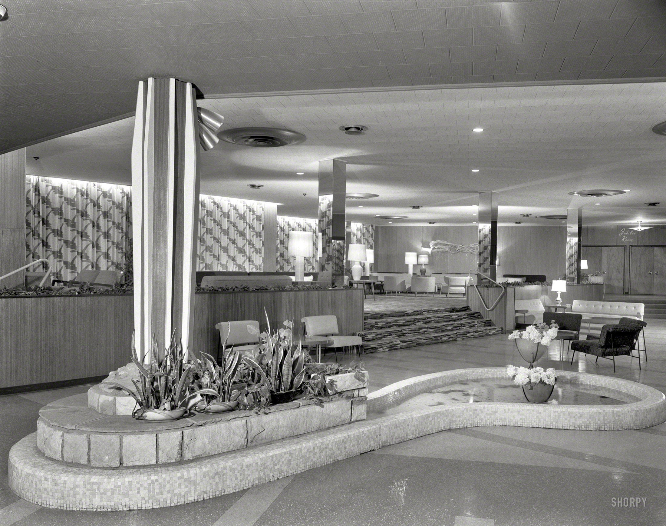August 13, 1957. "Hotel Zeiger. Ellenville, New York. General lobby." Join us in the Jubilee Room for cocktails and dancing! That stair rail looks like it was filched off a pool table. Large format negative by Gottscho-Schleisner. View full size.