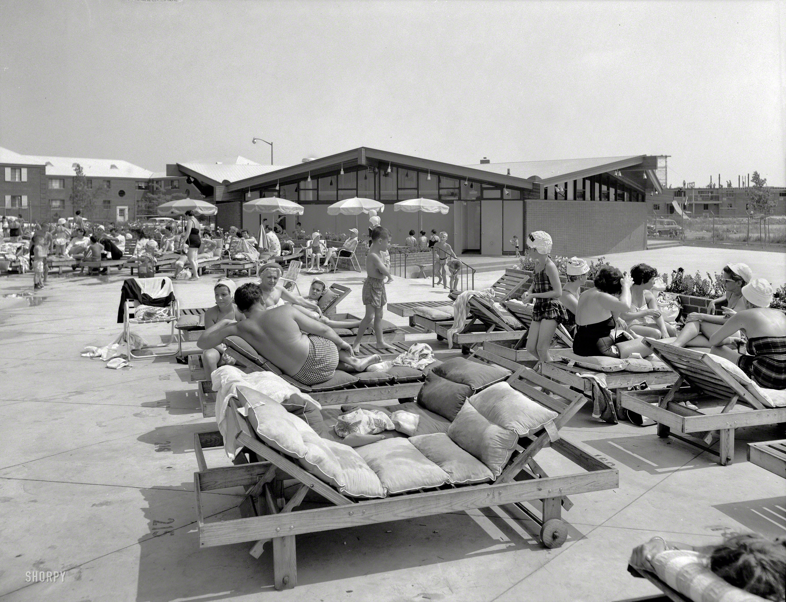 August 19, 1959. "Linden Woods Swim Club, Howard Beach, Queens. View to clubhouse. Lapidus, Kornblath, Harle & Liebman, client." Milton, honey. Bring me a Pepsi. And a pack of Salems. Gottscho-Schleisner photo. View full size.