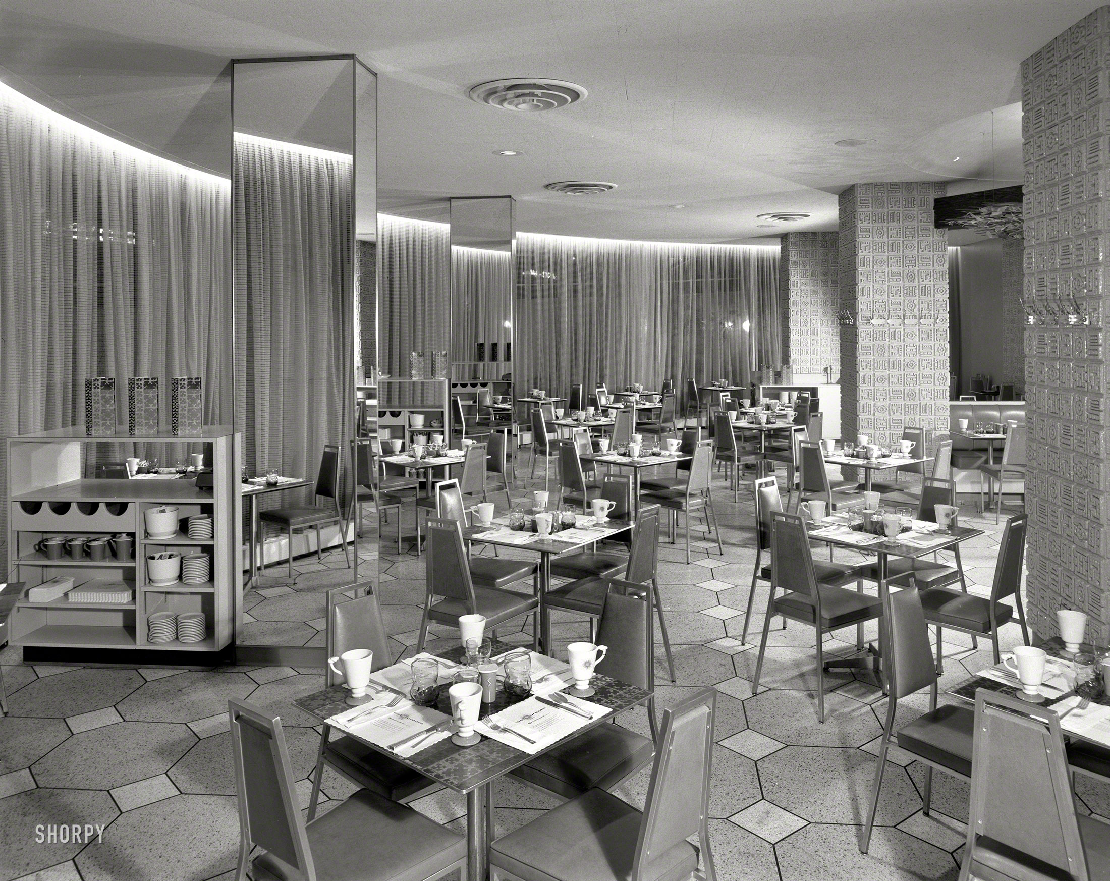 October 31, 1962. "Americana Hotel, 52nd Street and Seventh Avenue, New York City. Coffee shop II. Loew's Hotels. Morris Lapidus, Harle & Liebman architects." Large-format acetate negative by Gottscho-Schleisner. View full size.