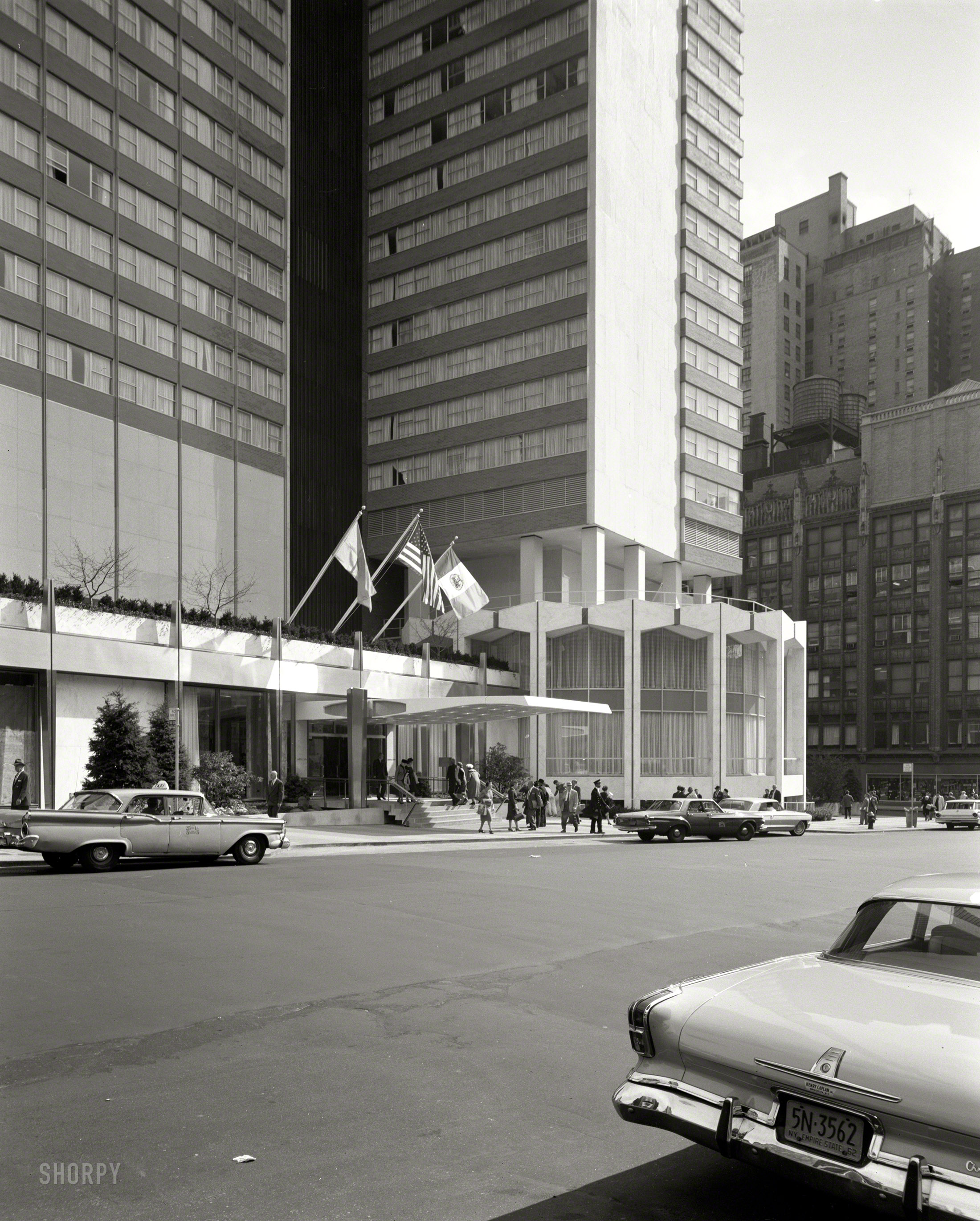 Oct. 1, 1962. "Americana Hotel, 52nd Street and Seventh Avenue, New York City. Entrance section from left. Loew's Hotels, client. Morris Lapidus, Harle & Liebman, architects." We saw the coffee shop a few weeks ago. Large-format acetate negative by Gottscho-Schleisner. View full size.
