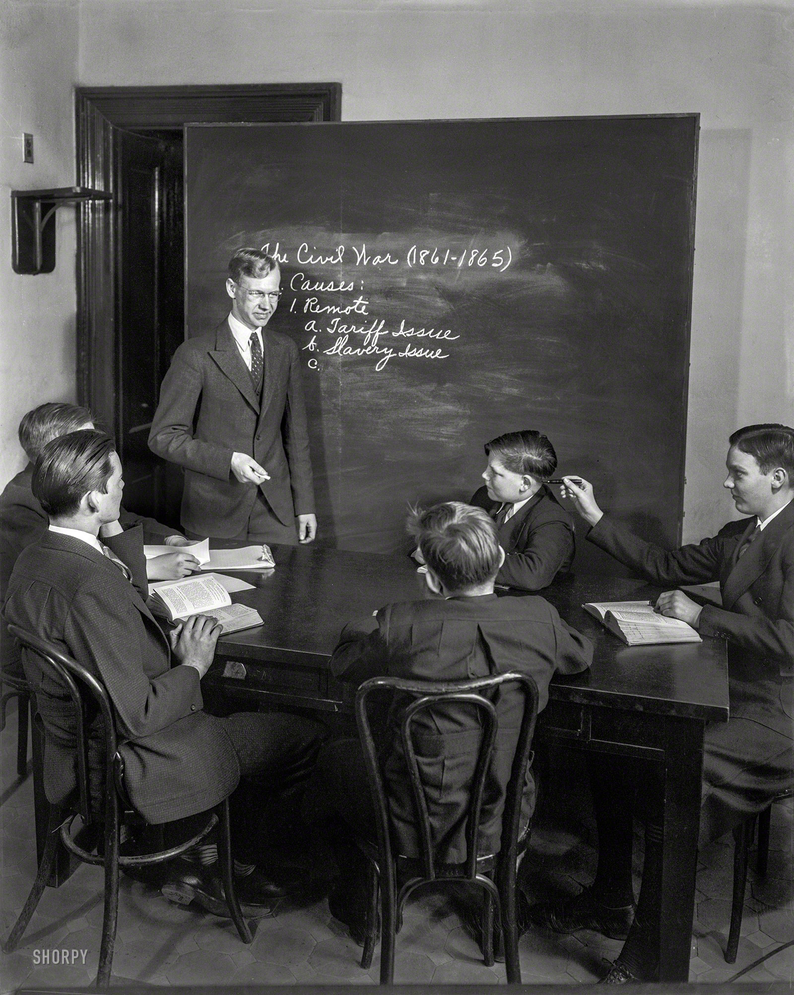 Washington, D.C., circa 1940. "Ernest Kendall, teacher of U.S. Capitol pages." Note old-school schoolboy mischief. Photo by Theodor Horydczak. View full size.