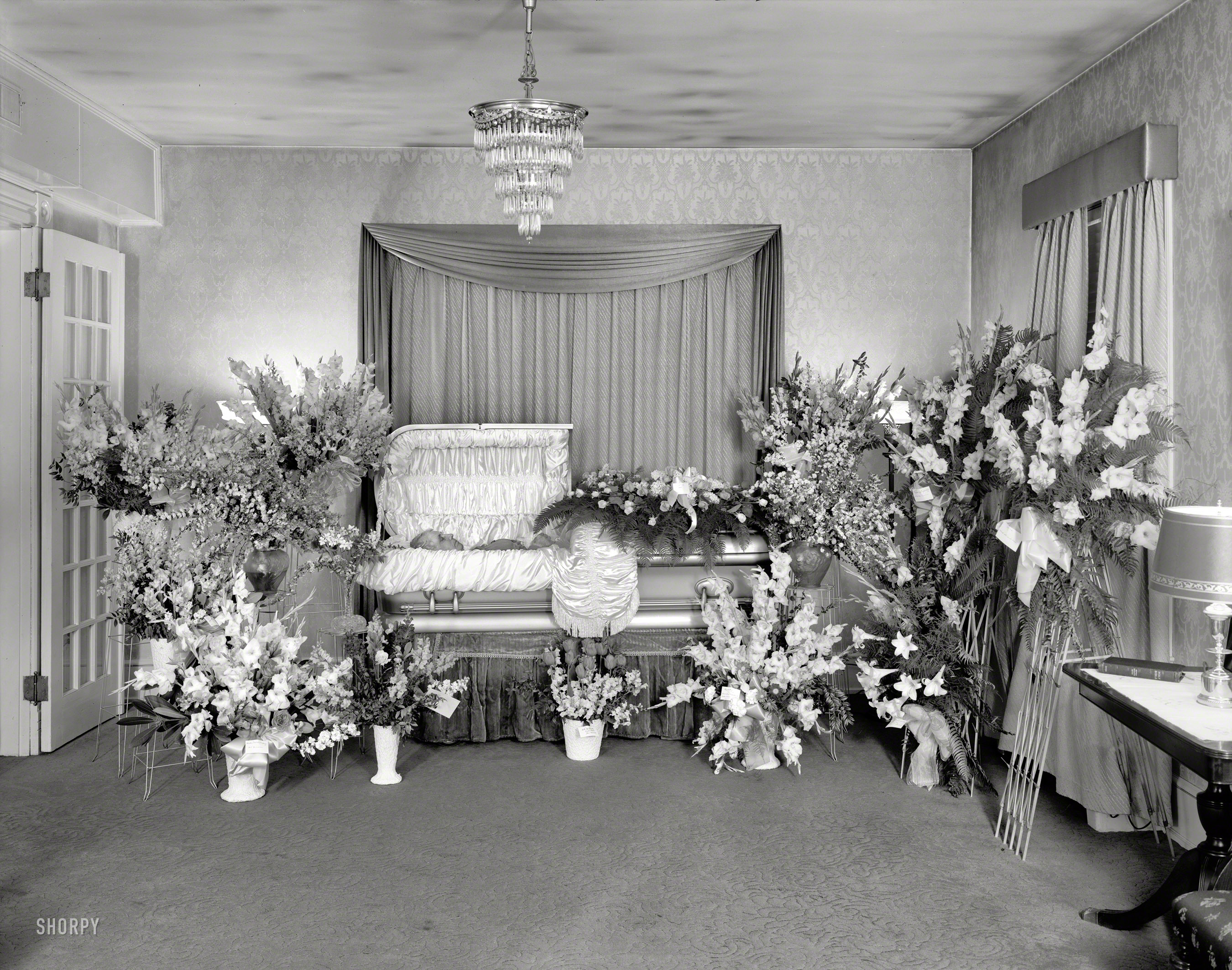 May 1950. Washington, D.C. "Miss Dorothy Torr [client]. Funeral flowers." Rose Bell Torr in repose. Safety negative by Theodor Horydczak. View full size.