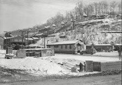 March 1937. "Scott's Run, West Virginia. Pursglove No. 2 coal mine. Scene taken from main highway shows company store and typical hillside camp." Photograph by Lewis Wickes Hine, three years before his death. View full size.