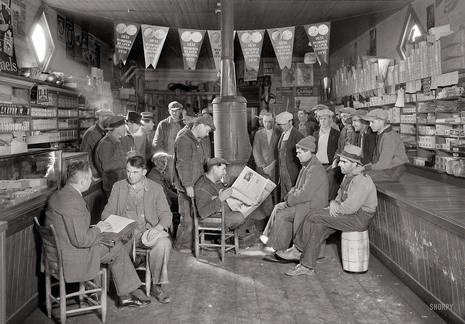 November 1933. "E.H. Elam making interviews at Stiner's Store, Lead Mine Bend, Tenn. Selections for employment with the TVA are made on the basis of ability and efficiency." The vast hydroelectric and flood control project overseen by the Tennessee Valley Authority was one of the New Deal programs enacted under the Roosevelt Administration. Photo by Lewis Hine. View full size.