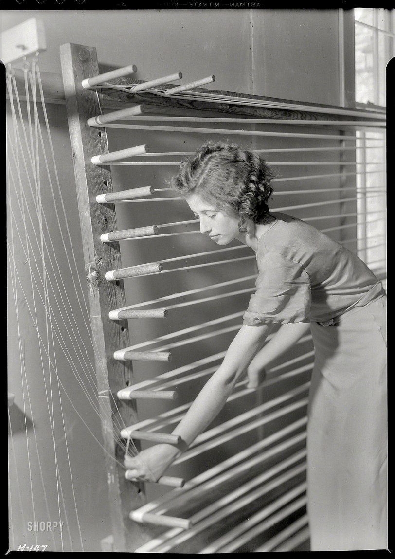 November 1933. Gatlinburg, Tennessee. "Beulah Ogle preparing warp for weaving at the Pi Beta Phi School. She is a new weaver at the school and lives on a mountain farm." Another example of Lewis Hine's post-newsie oeuvre. Large format nitrate negative, National Archives. View full size.
