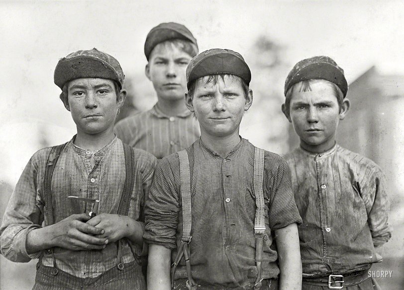 January 1909. Macon, Georgia. "Some doffer boys." For those of us rusty on our cotton mill terminology, the job entailed the removal ("doffing") and replacement of thread bobbins when they were empty. Photograph by Lewis Wickes Hine for the National Child Labor Commission. View full size.