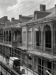 New Orleans circa 1923. "Upper stories of buildings with wrought iron balconies." 4x5 nitrate negative by Arnold Genthe. View full size.