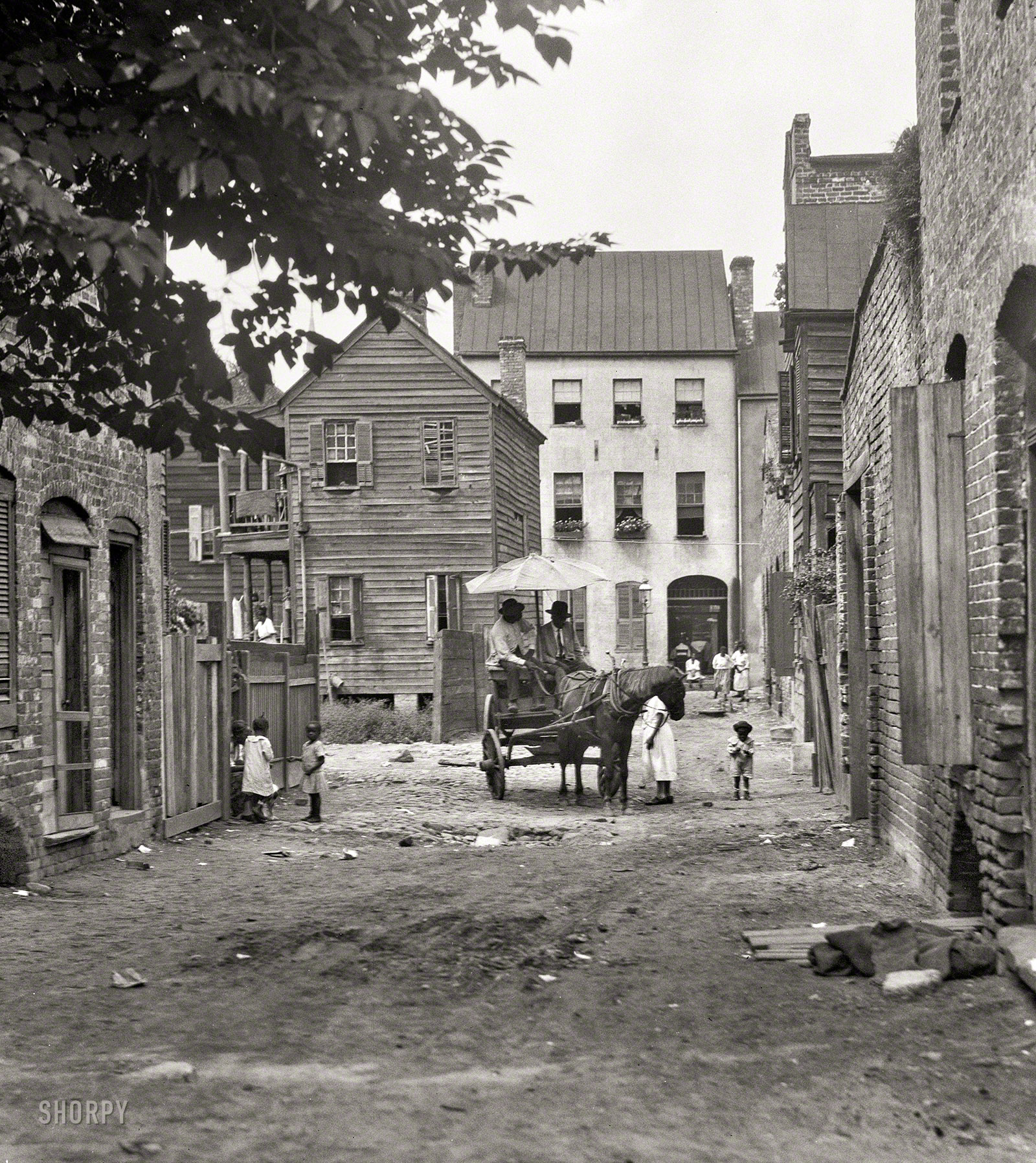 Charleston, South Carolina, circa 1920. "Street scene with horse and wagon." 4x5 inch nitrate negative by Arnold Genthe. View full size.