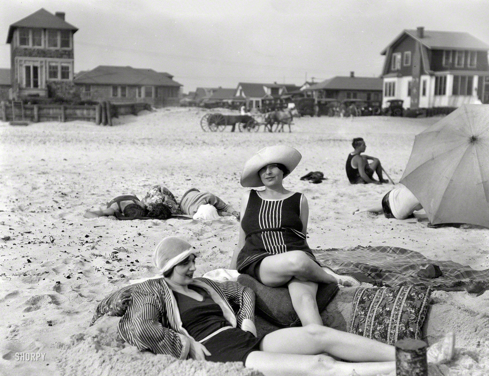 1920s. "Unidentified women at Long Beach, New York." Two Jazz Age sunbathers just in from West Egg. Nitrate negative by Arnold Genthe. View full size.