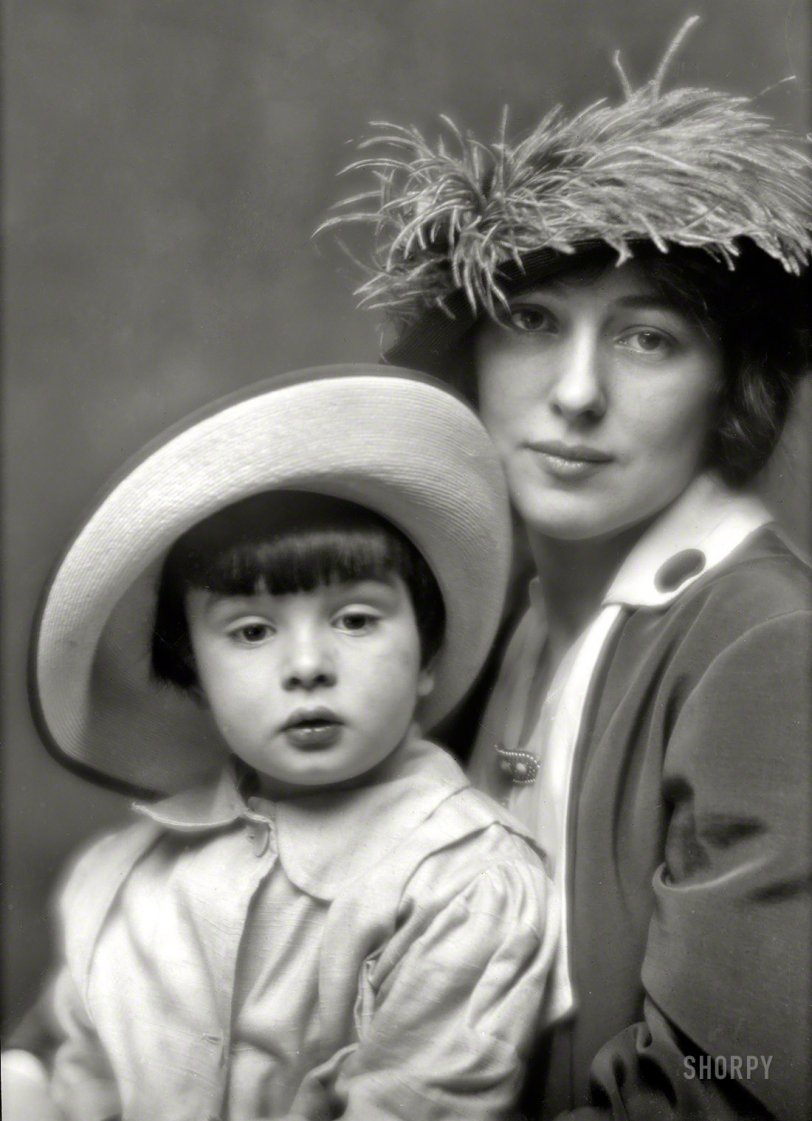 New York, 1913. "Mrs. Evelyn Nesbit Thaw and son." Photo by Arnold Genthe, whose serene portrait belies the intensity of the scandal that engulfed Evelyn when her husband killed her former lover, the architect Stanford White, in 1906. While Harry Thaw denied paternity of the child raised as his son, Evelyn always maintained that Russell Thaw was conceived during a conjugal visit with her husband at Matteawan State Hospital for the Criminally Insane. View full size.
