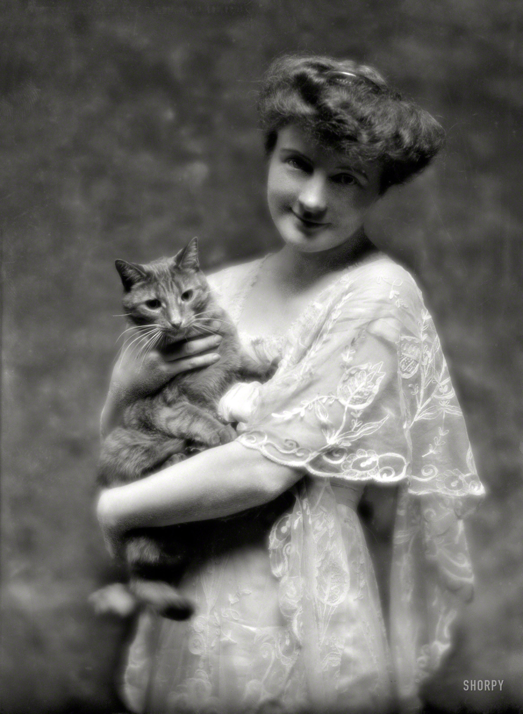 May 12, 1914. "King, G., Miss, with Buzzer the cat. 135 E. 66th Street, New York City." Buzzer served as a prop in dozens of these portraits by Arnold Genthe. 5x7 glass negative, with much curlicue stippling. View full size.