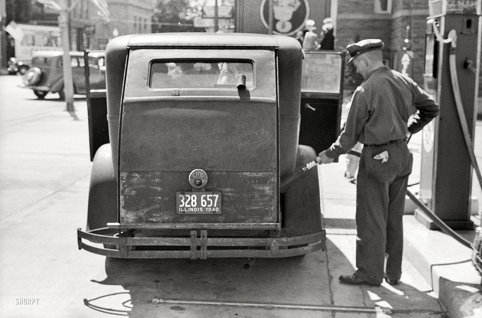 July 1940. "Auto of migrant fruit worker at gas station in Sturgeon Bay, Wisc." Photo by John Vachon for the Farm Security Administration. View full size.