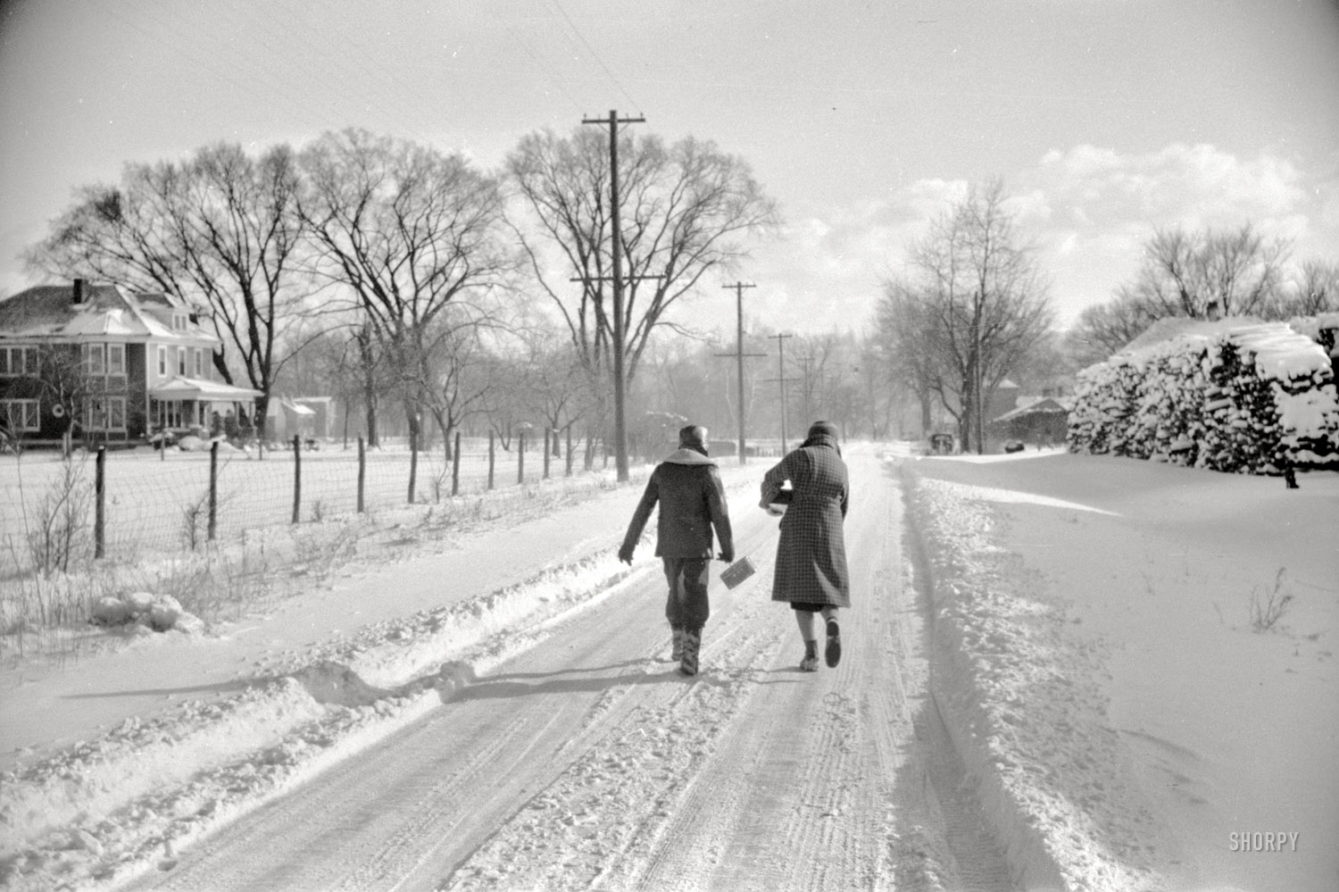 February 1940. Chillicothe, Ohio. "Children going home from school." 35mm negative by John Vachon for the Farm Security Administration. View full size.