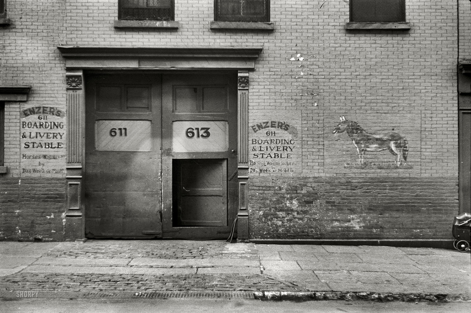January 1938. "Front of livery stable, East Side, New York City." 35mm nitrate negative by Russell Lee for the Farm Security Administration. View full size.
