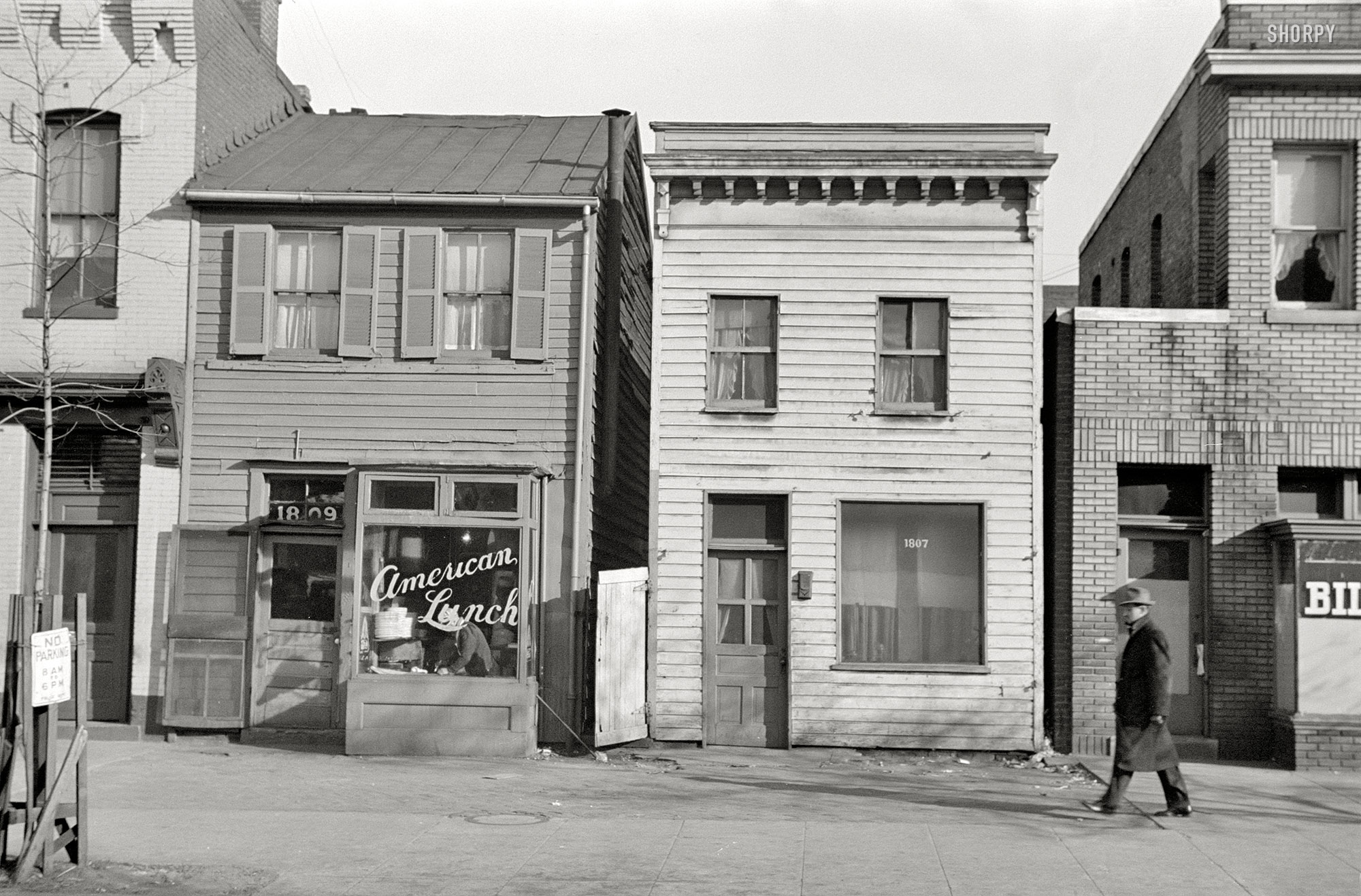 January 1938. Washington, D.C. "Buildings on L Street." 35mm nitrate negative by Russell Lee for the Farm Security Administration. View full size.