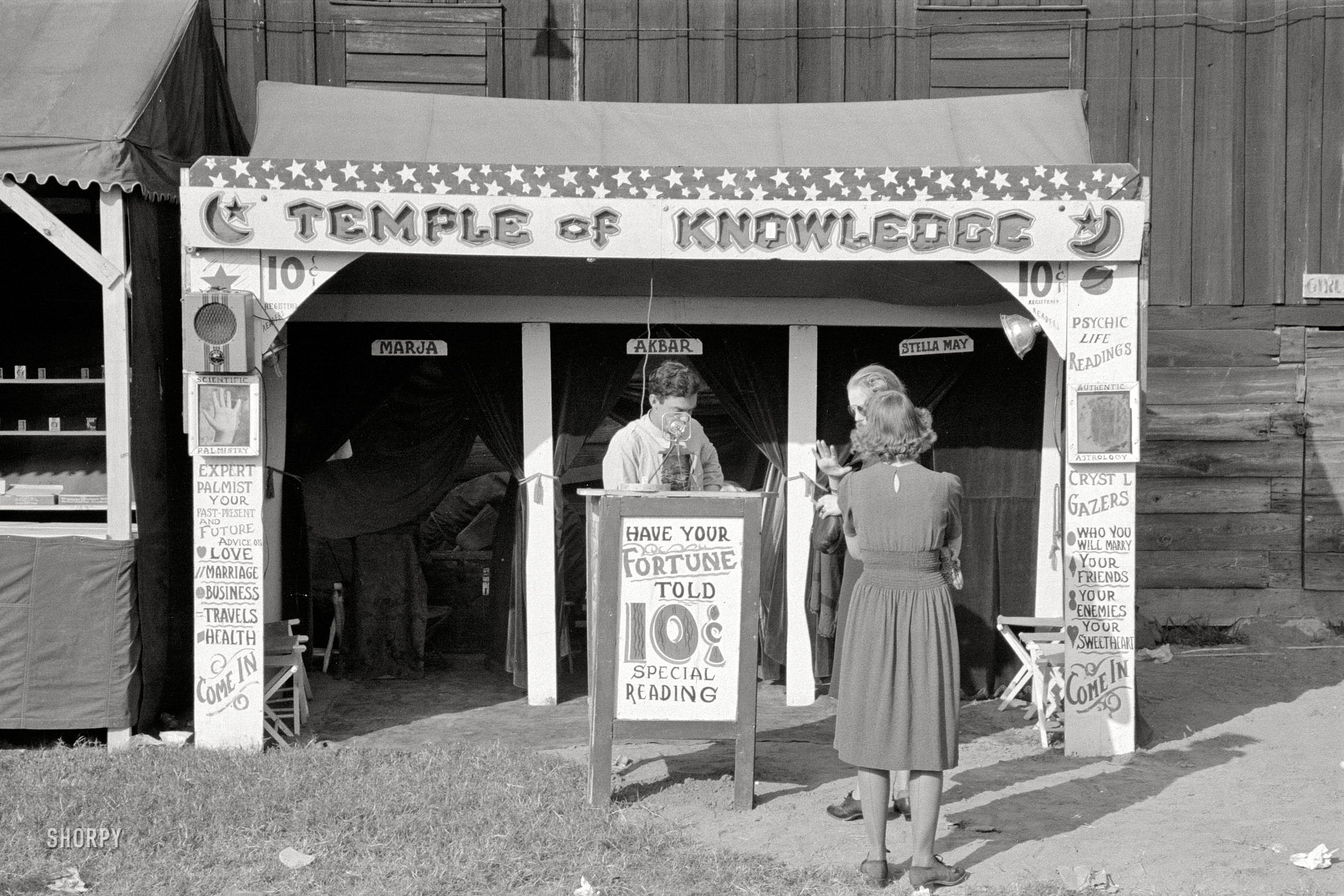 November 1938. "Fortune teller's cubicle, state fair. Donaldsonville, Louisiana." 35mm negative by Russell Lee, Farm Security Administration. View full size.