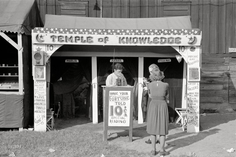 November 1938. "Fortune teller's cubicle, state fair. Donaldsonville, Louisiana." 35mm negative by Russell Lee, Farm Security Administration. View full size.
