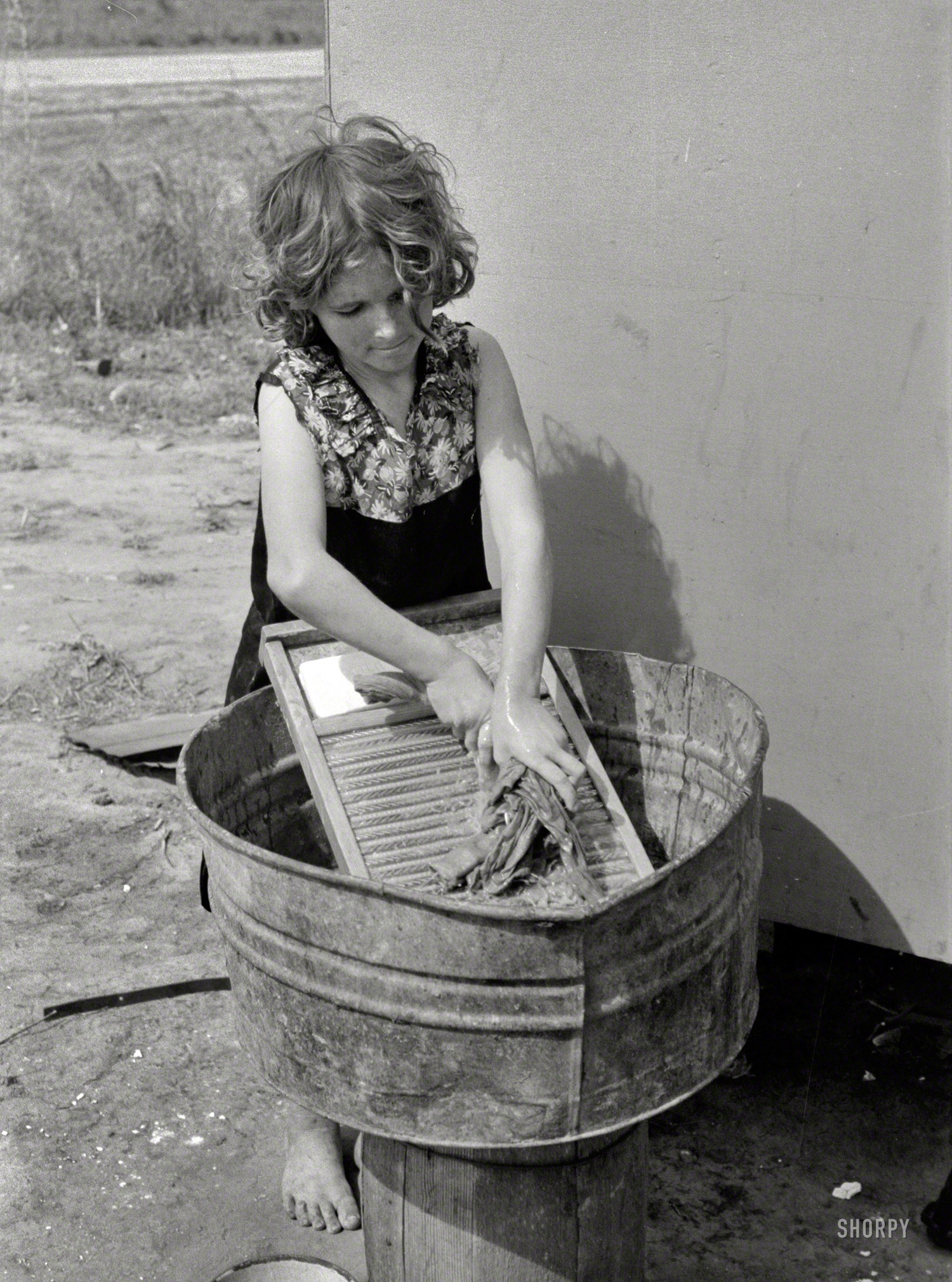 February 1939. "Twelve-year-old girl who keeps house in a trailer for her three brothers who are migrant workers, near Harlingen, Texas." 35mm nitrate negative by Russell Lee for the Farm Security Administration. View full size.