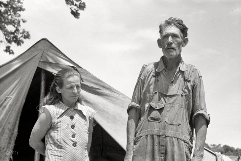 June 1939. Another look at the fellow we saw here last week, this time with some company. "Veteran migrant worker and his wife camped in Wagoner County, Oklahoma. He has followed the road for about 30 years. When asked where his home was he said, 'It's all over.'" 35mm negative by Russell Lee. View full size.
