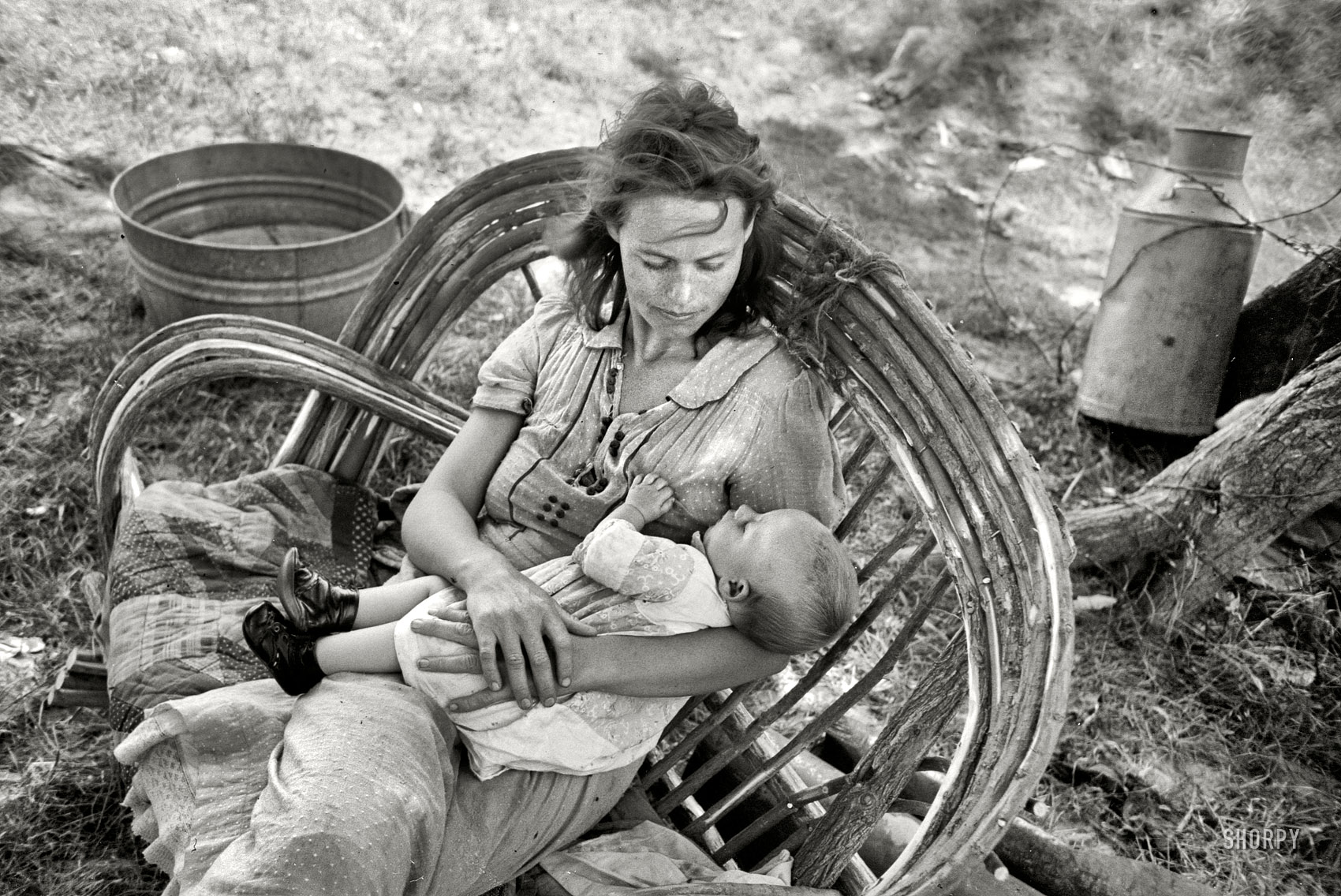 June 1939. "Wife and baby of itinerant cane furniture maker and agricultural day laborer camped in Wagoner County, Oklahoma." 35mm nitrate negative by Russell Lee for the Farm Security Administration. View full size.