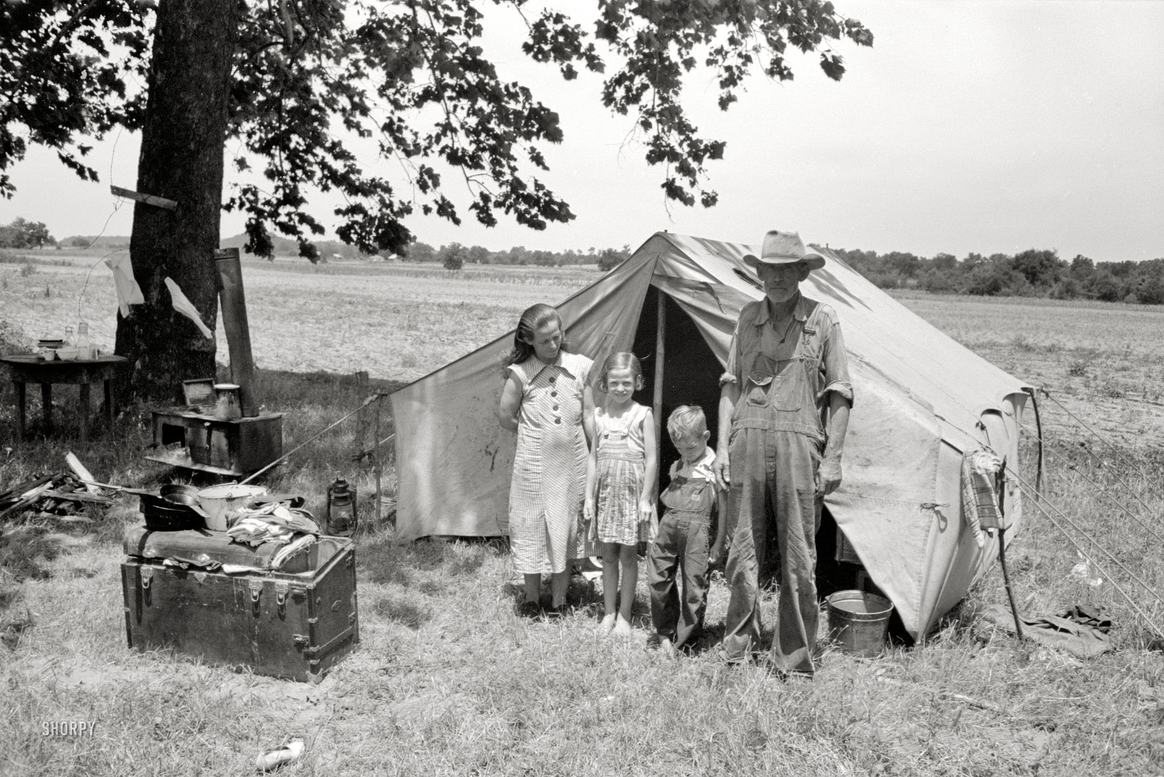 June 1939. "Wagoner County, Oklahoma. Veteran migrant agricultural worker and his family encamped on the Arkansas River." Our third look at this grizzled laborer (One, Two). 35mm negative by Russell Lee for the FSA. View full size.