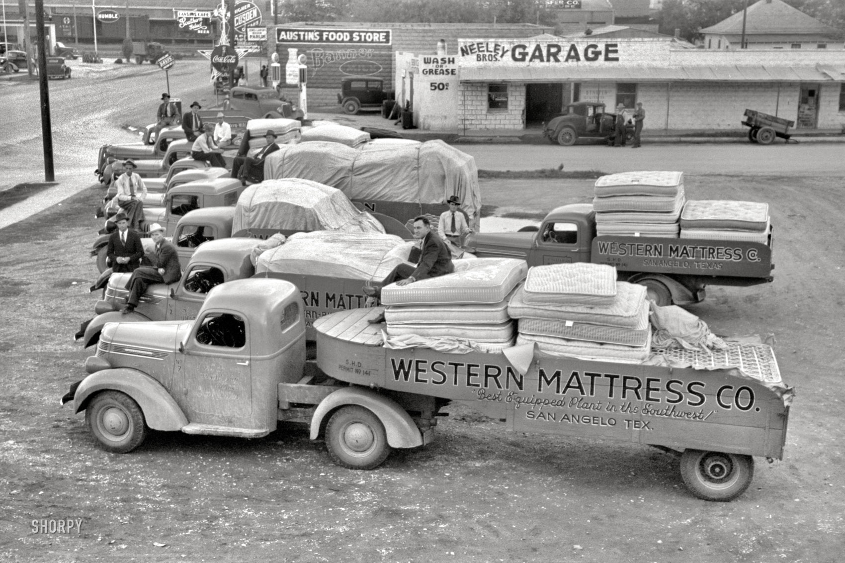 November 1939. "Trucks loaded with mattresses at San Angelo, Texas. These mattress factories use much local cotton." 35mm nitrate negative by John Vachon for the Farm Security Administration. View full size.
