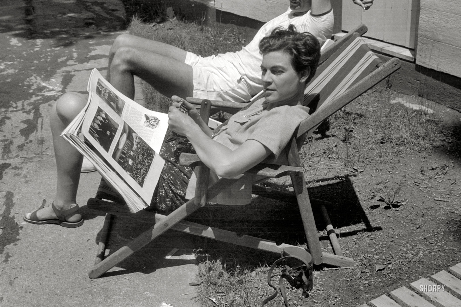 Another shot of someone who may or may not be Penny Vachon, perusing the February 1939 issue of Fortune. Photo by John Vachon. View full size.