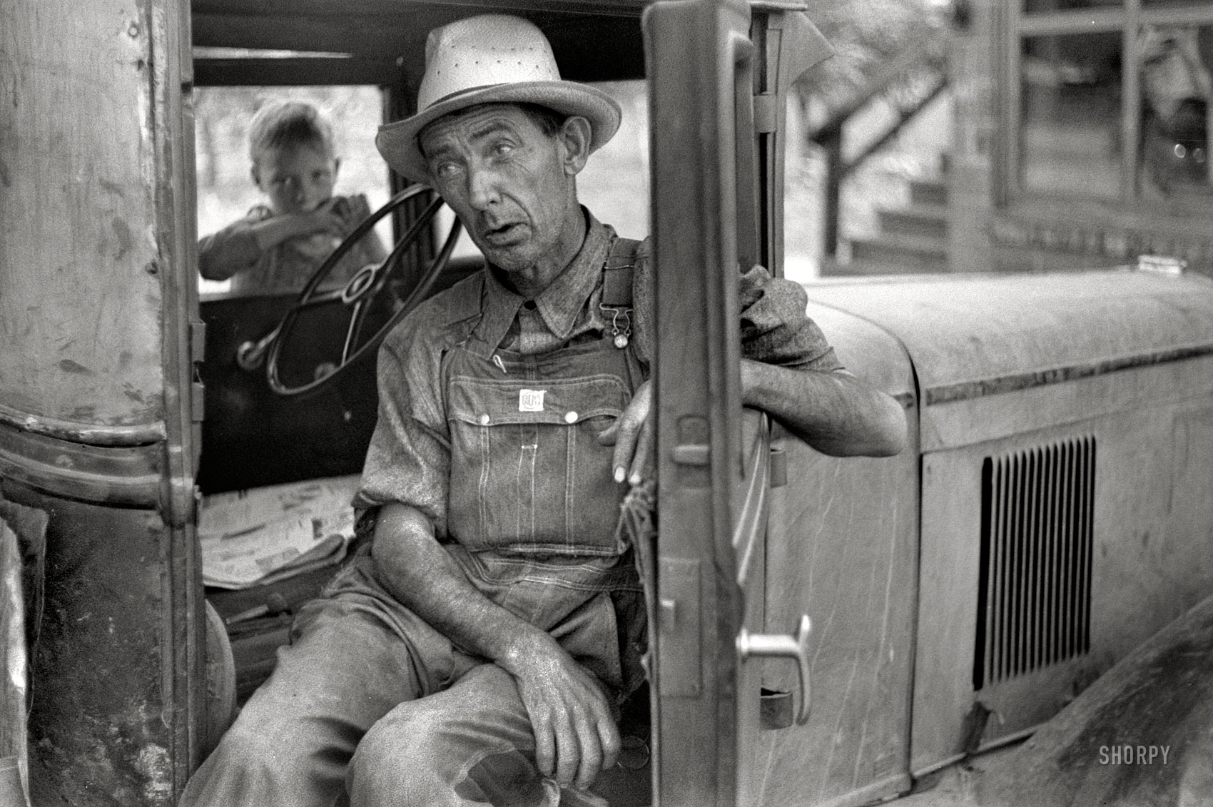 July 1940. "Arkansas farmer now picking fruit in Berrien County, Michigan." Wearing Tuf-Nut overalls. Photo by John Vachon for the FSA. View full size.