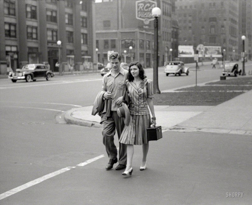 "Michigan Avenue, Chicago, July 1941." And just a block ago, they were strangers. 35mm negative by John Vachon, who has a lens for the ladies. View full size.
