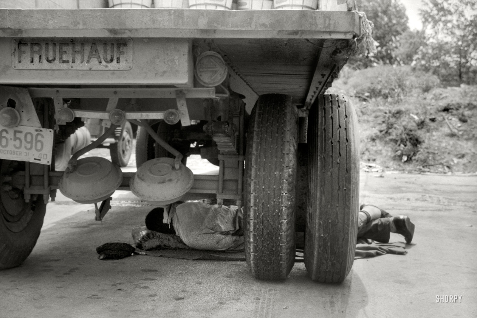 June 1940. Washington, D.C. "Negro driver asleep under a truck. There are no sleeping accommodations for Negroes at this service station on U.S. 1." Photo by Jack Delano for the Farm Security Administration. View full size.