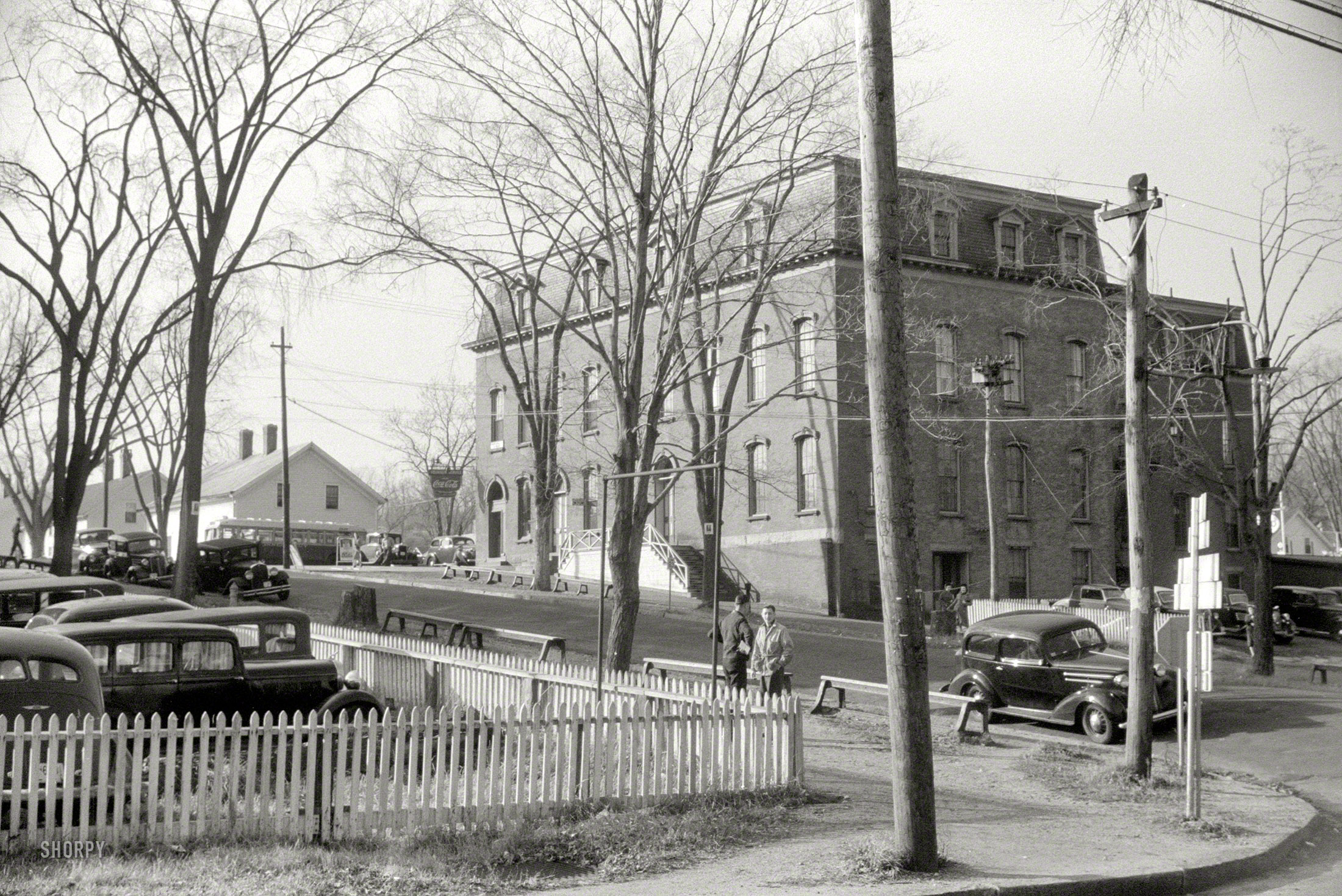 November 1940. Taftville, Connecticut. An uncaptioned shot by Jack Delano taken from the grounds of the Penomah Mills factory. Note the Coke sign. Archie and Betty no doubt somewhere nearby. 35mm nitrate negative. View full size.