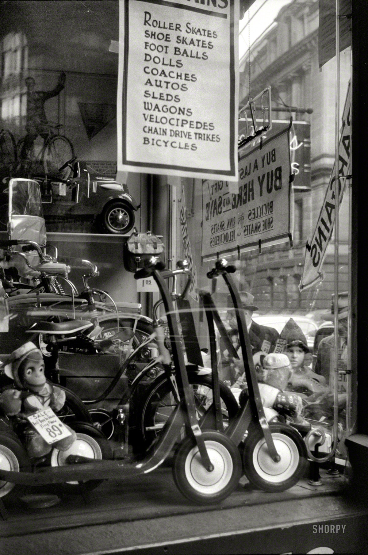 December 1940. "Window display for Christmas sale. Providence, Rhode Island." "Billy" now just 89 cents! 35mm nitrate negative by Jack Delano. View full size.