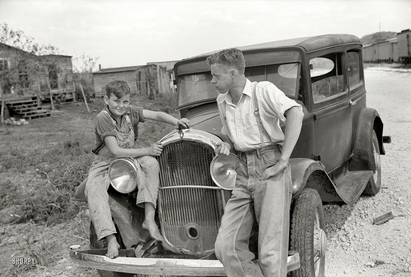 February 1939. "Migrant laborer's family near Canal Point packinghouse, Florida." 35mm nitrate negative by Marion Post Wolcott. View full size.