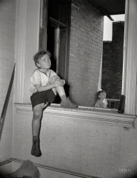 June 1942. Washington, D.C. "Boys playing in wrecked houses on Independence Avenue across from the Smithsonian Institution." Large format negative by Gordon Parks for the Office of War Information. View full size.