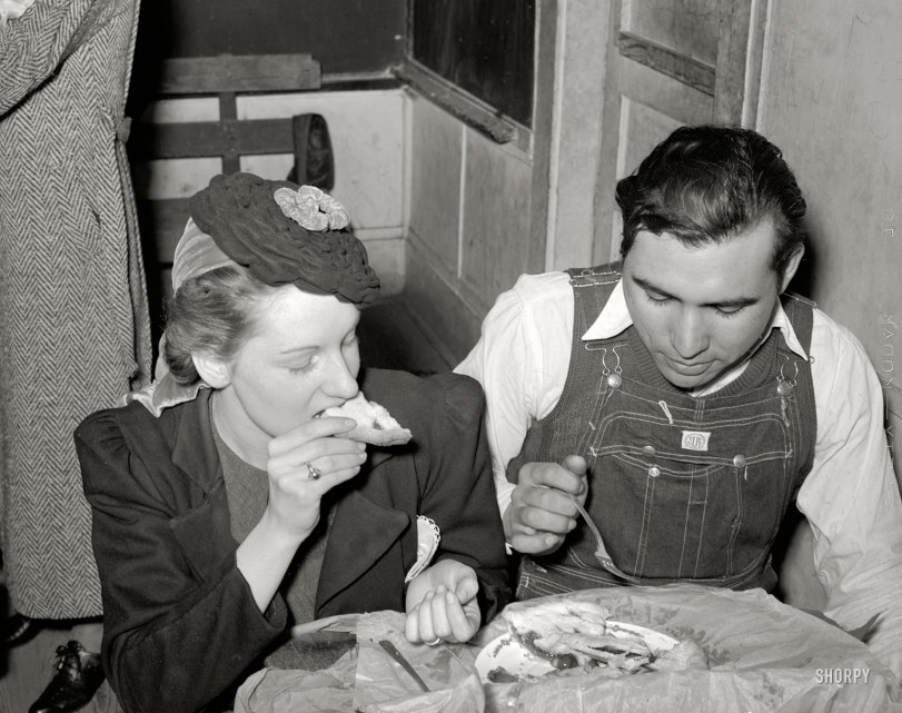 February 1940. Muskogee County, Oklahoma. "Farm boy eating pie which he bought at auction and which was made by the girl with whom he is sitting." Sometimes a delicious cherry pie is only the first course. Medium format negative by Russell Lee for the Farm Security Administration. View full size.
