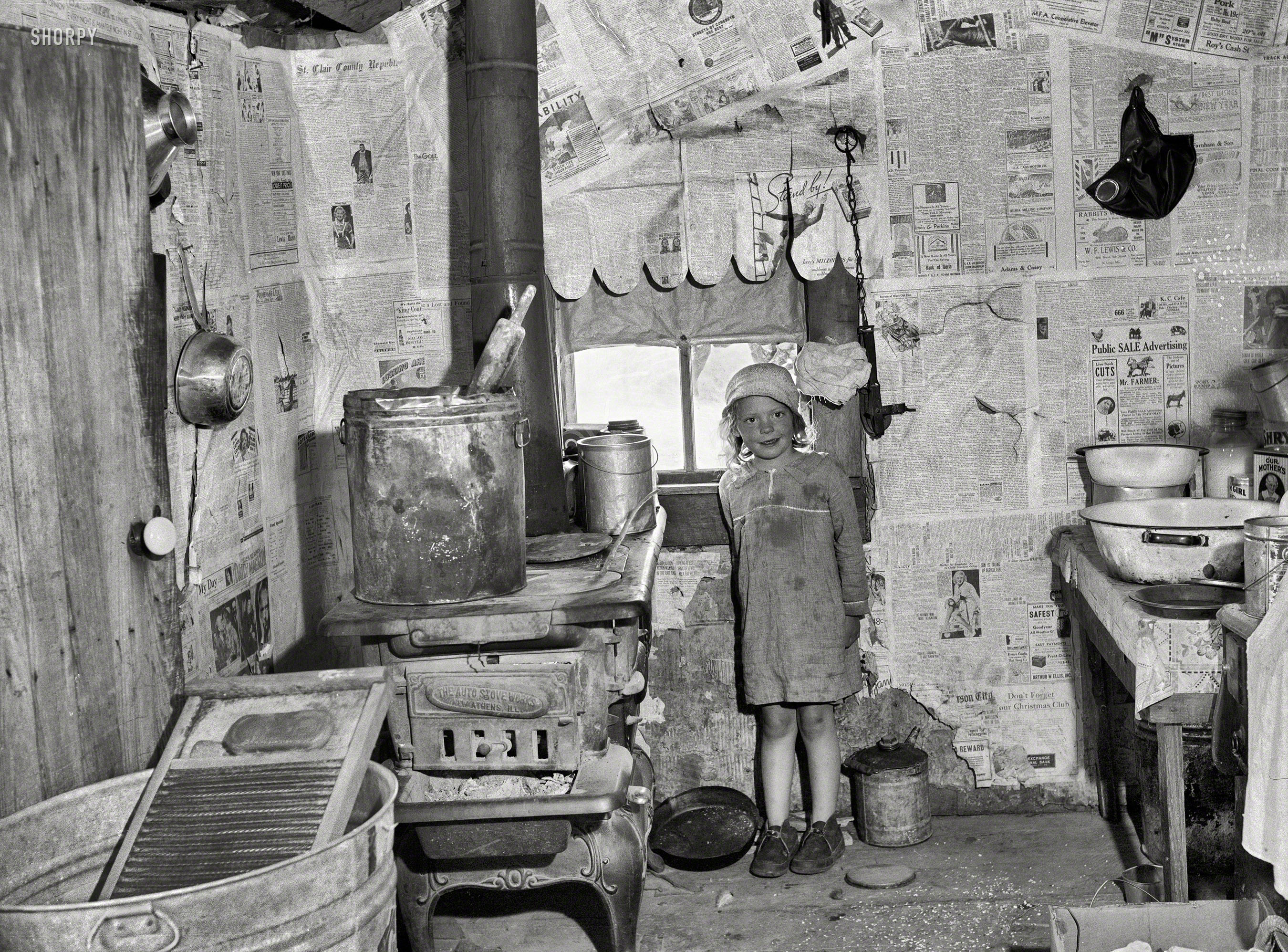 May 1936. "Sharecropper shack. Kitchen of Ozarks cabin purchased for Lake of the Ozarks project. Missouri." Photo by Carl Mydans, Resettlement Administration. View full size.